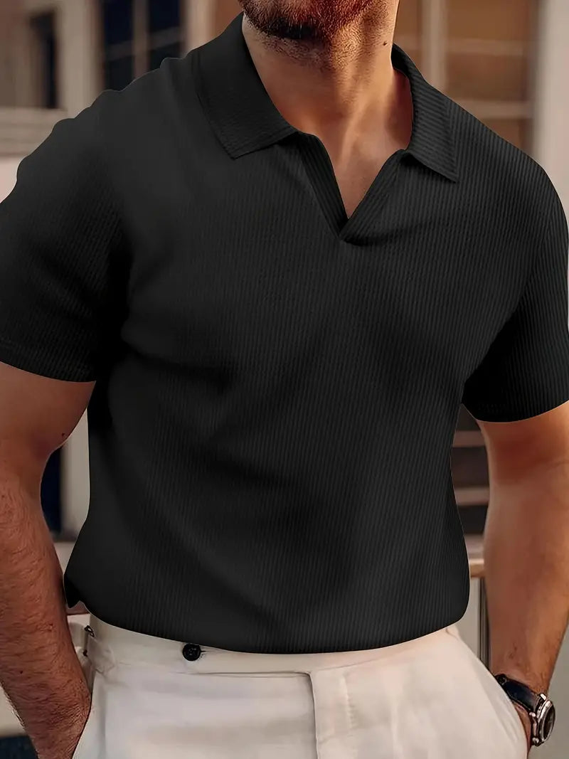 Classic black men's short-sleeve polo shirt, perfect for smart casual outfits and everyday wear. A wardrobe essential.