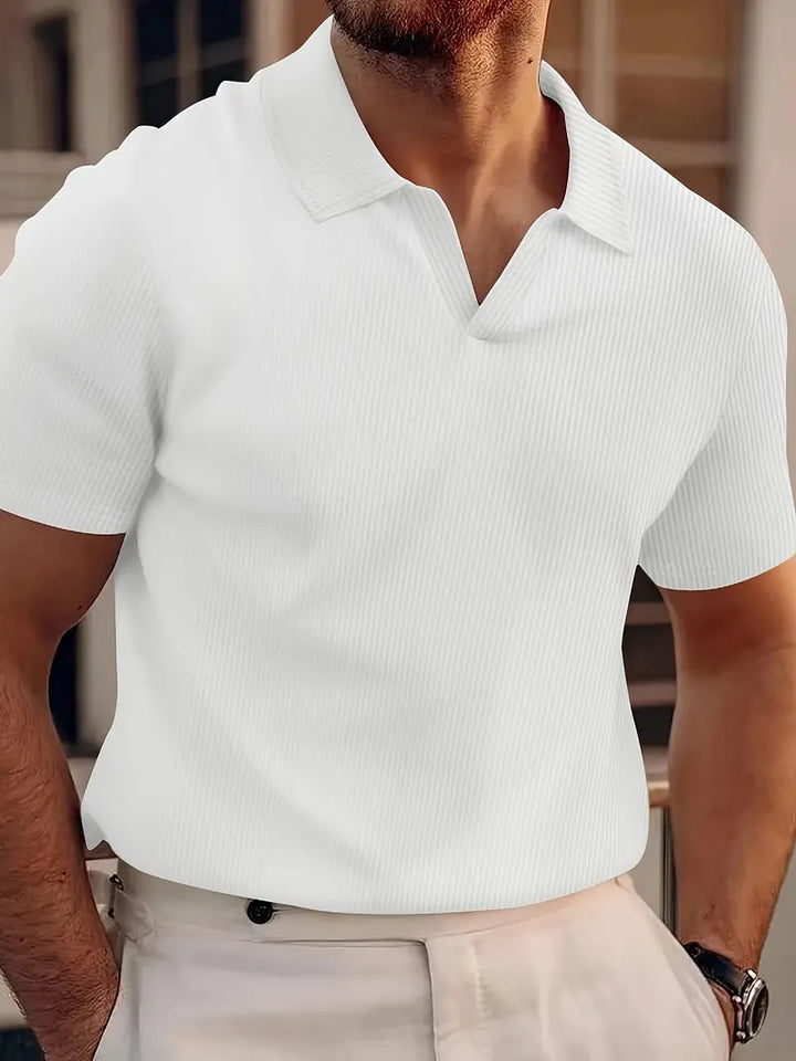 Crisp white men's short-sleeve polo shirt, a smart casual top. Perfect for summer fashion and versatile daily wear.