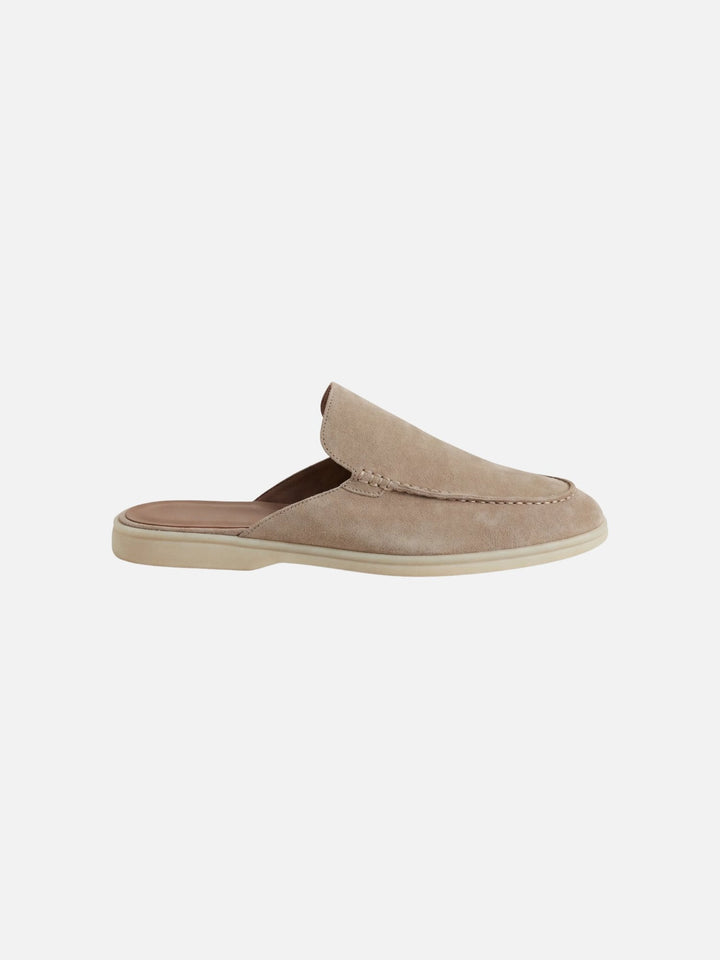 Men's casual slip-on mules with an open heel, featuring stylish stitched detail. Comfortable summer footwear.