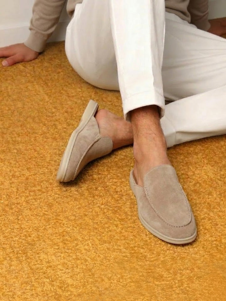 Stylish men's slip-on mules for casual fashion. Features an open heel & unique stitched detailing on top.