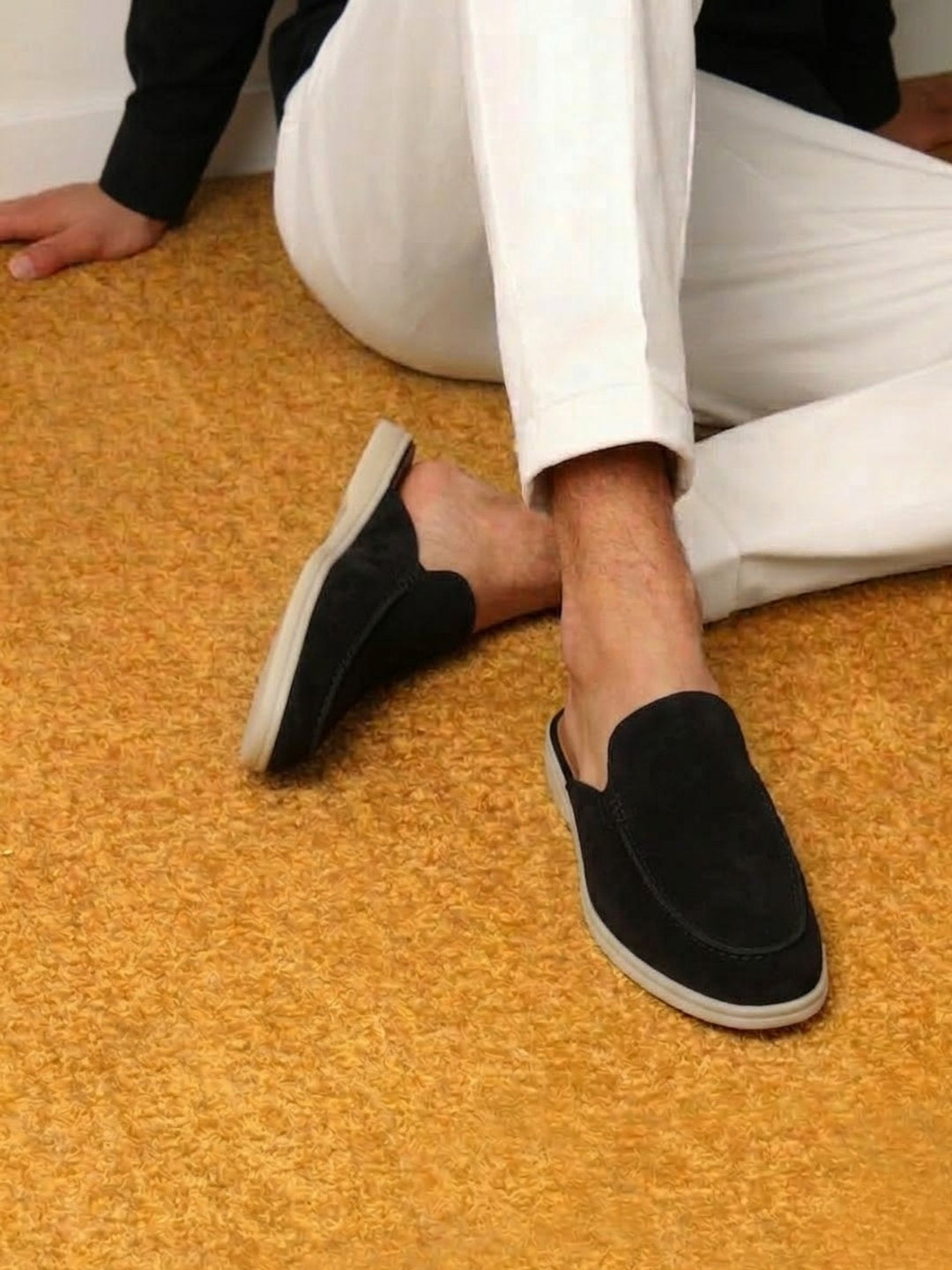 Side view of men's slip-on mules with open heel & intricate stitched detailing. Versatile smart casual footwear.