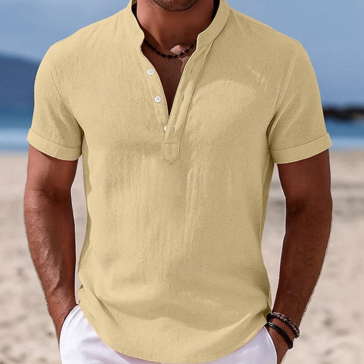 Detailed view of buttons on a men's casual summer short sleeve button-up, emphasizing stylish design.