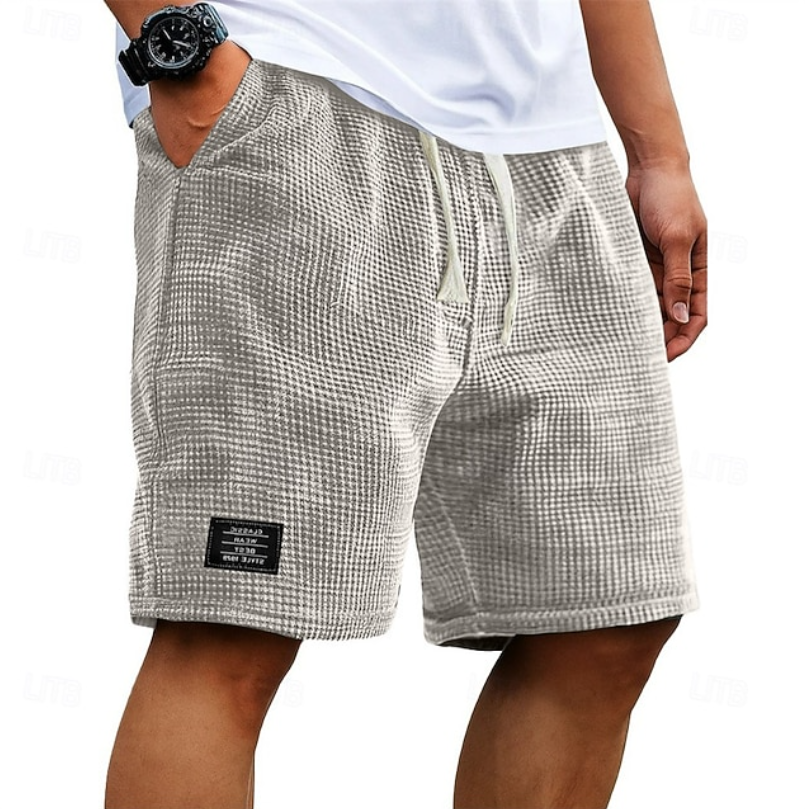 Relaxed fit men's summer shorts for versatile daily outfits. Comfortable & breathable for leisure wear.