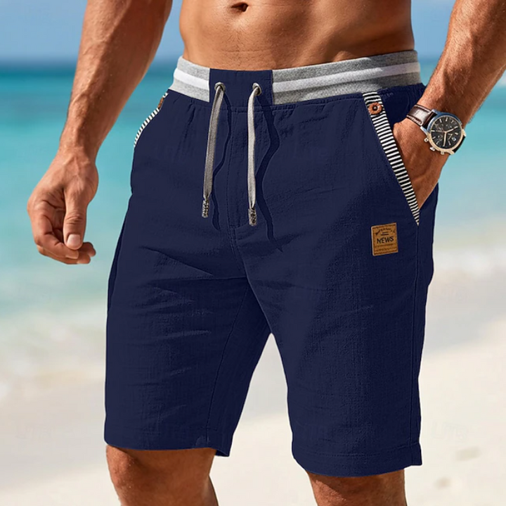 Relaxed fit men's summer shorts with subtle lace detail, great for vacation, beach days, or comfortable everyday warm-weather style.
