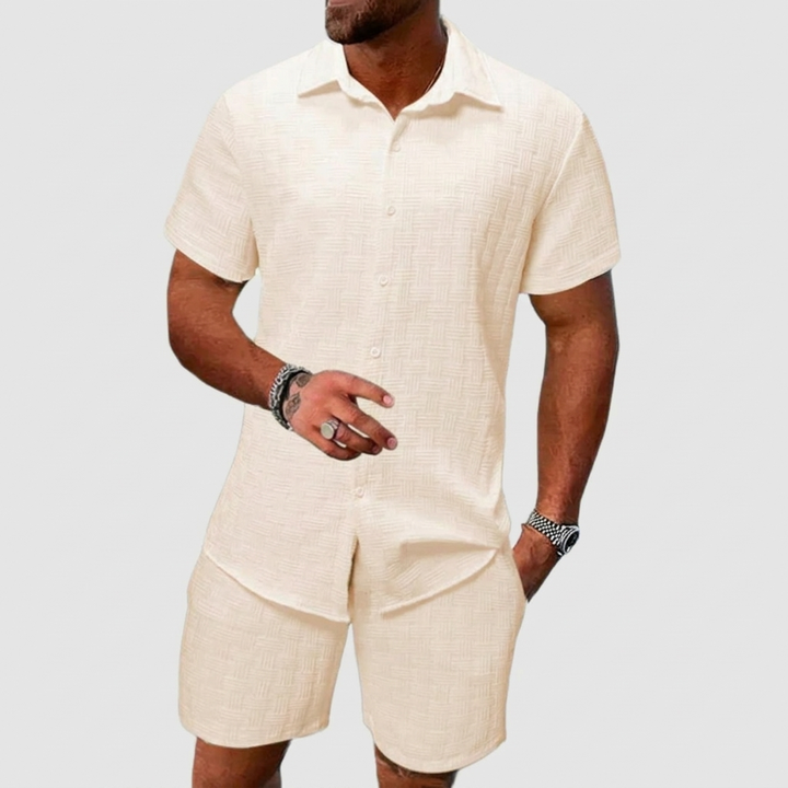 Relaxed fit men's summer two-piece outfit; short-sleeve button-up shirt & matching shorts, perfect for casual wear.