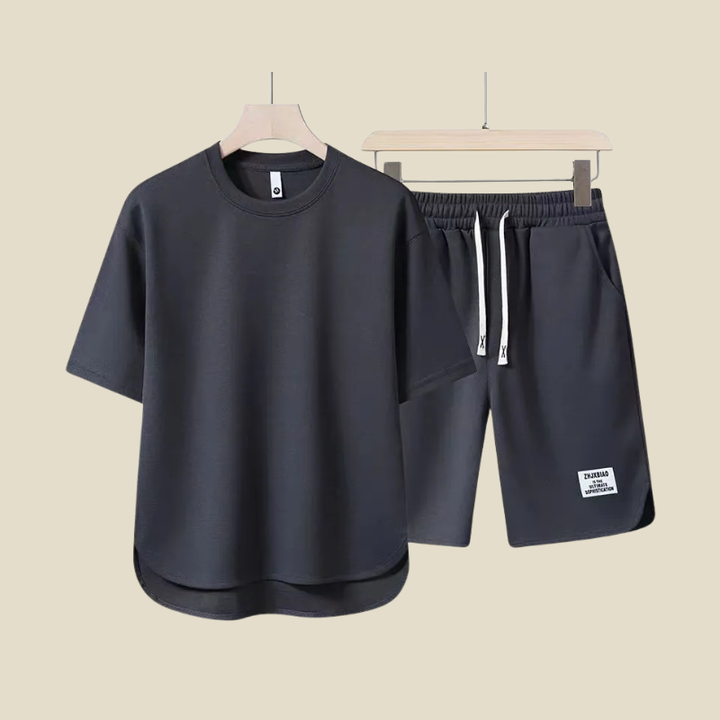 Comfortable men's two-piece summer set featuring a casual short sleeve t-shirt and relaxed fit drawstring shorts.