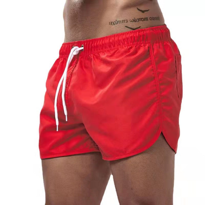 Comfortable men's swim shorts featuring an adjustable waist for a perfect fit at the beach.