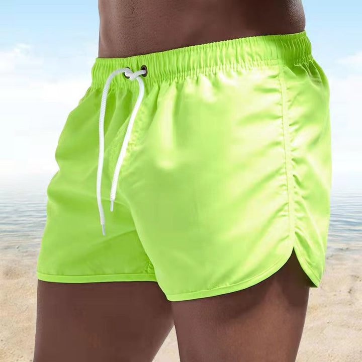 Men's beachwear swim shorts with adjustable drawstring for pool and summer fashion.