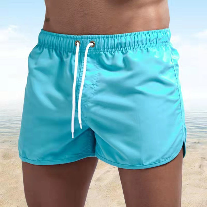 Trendy men's casual swim trunks, essential summer wear for beach and pool days.