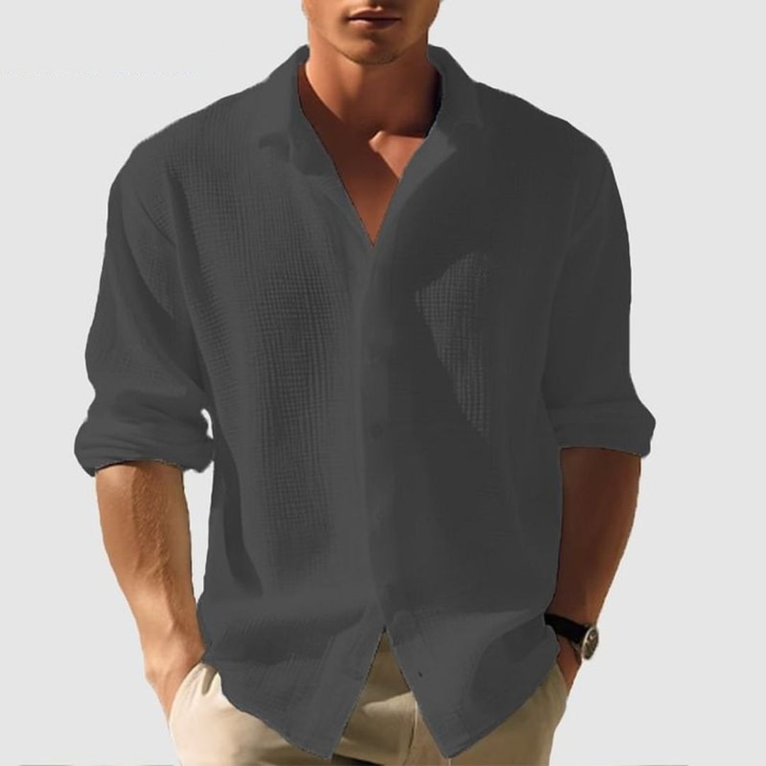 Comfortable men's relaxed fit textured button-down shirt, long sleeves, ideal for versatile smart casual outfits.