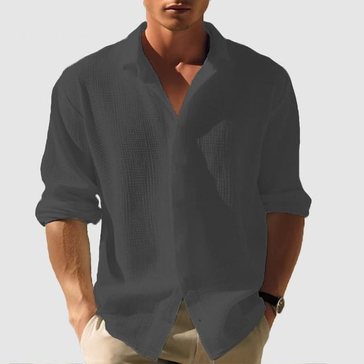 Comfortable men's relaxed fit textured button-down shirt, long sleeves, ideal for versatile smart casual outfits.