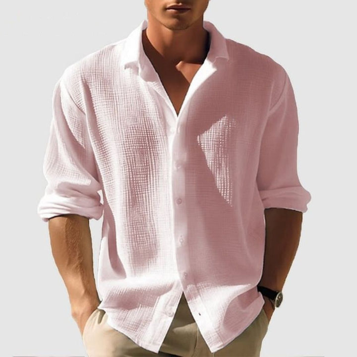 Relaxed fit men's casual shirt, long sleeves, featuring a comfortable textured fabric & classic button-down.