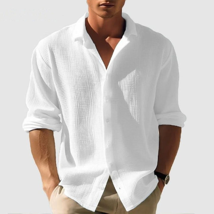 Modern men's textured button-down shirt, long sleeve, offering a stylish & comfortable option for any occasion.