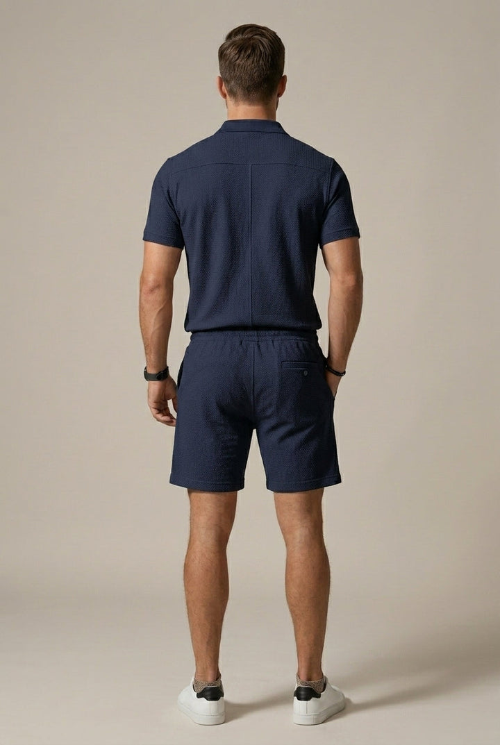 Stylish men's textured knit polo shirt and matching drawstring shorts set for summer loungewear.