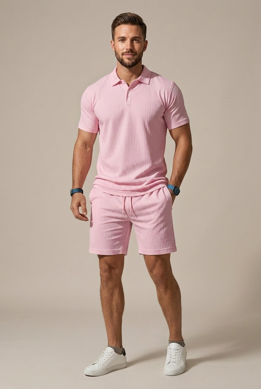 Man wearing a comfortable textured polo shirt and drawstring shorts set, suitable for relaxed summer days.