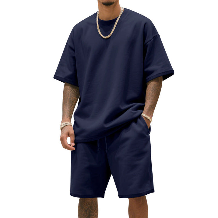 Modern men's loungewear set with a crew neck t-shirt and drawstring shorts for relaxed summer style.