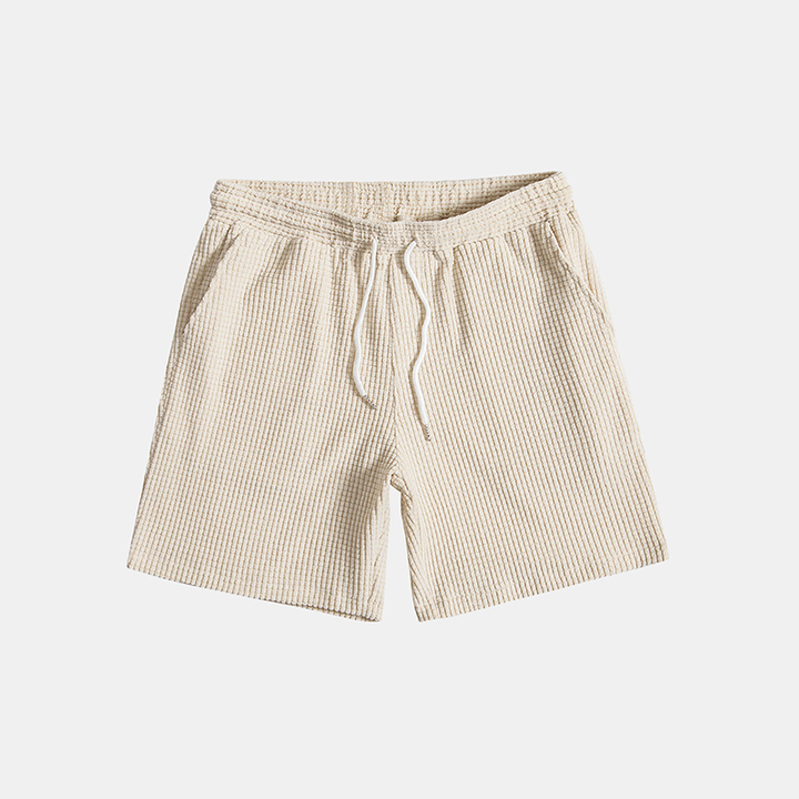 Men's two-piece summer outfit: casual button-up shirt & comfortable shorts. Great for beach style or vacation.
