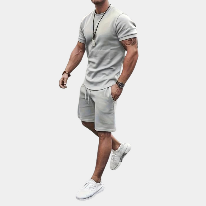 Stylish men's relaxed fit two-piece summer shorts set. Perfect casual wear for vacation or warm weather.