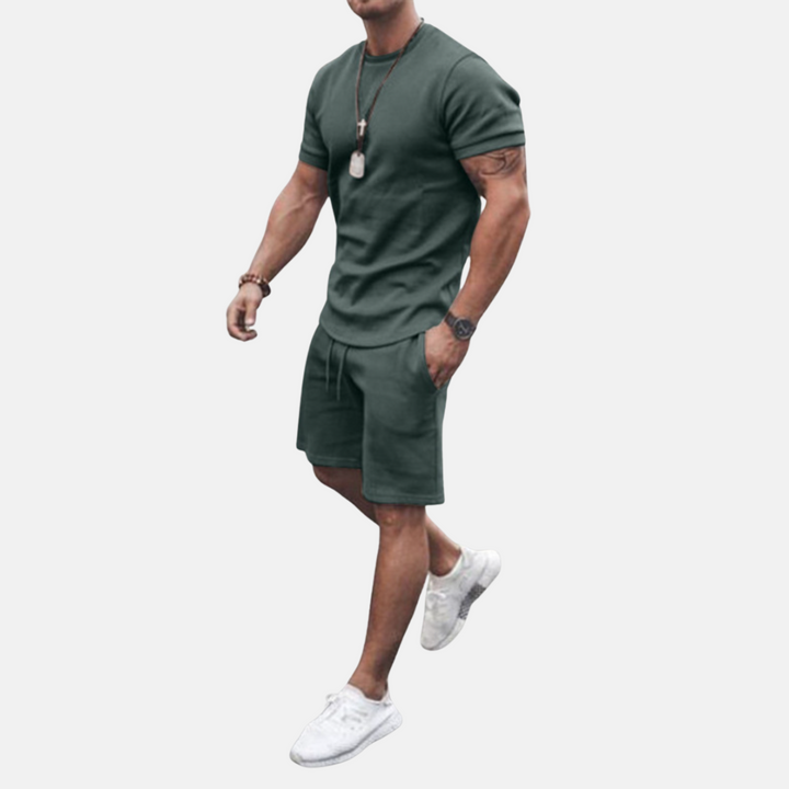 Men's comfortable two-piece summer shorts set. Relaxed fit short sleeve shirt & drawstring shorts ideal for vacation.