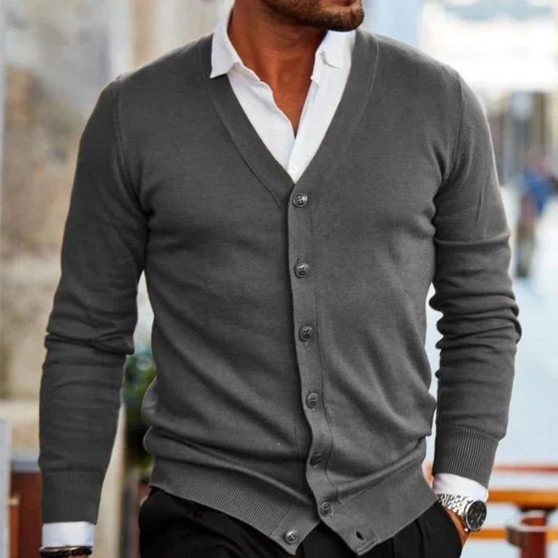Relaxed fit men's V-neck cardigan. Button-up knit, ideal for layering over shirts. Casual, everyday fashion.