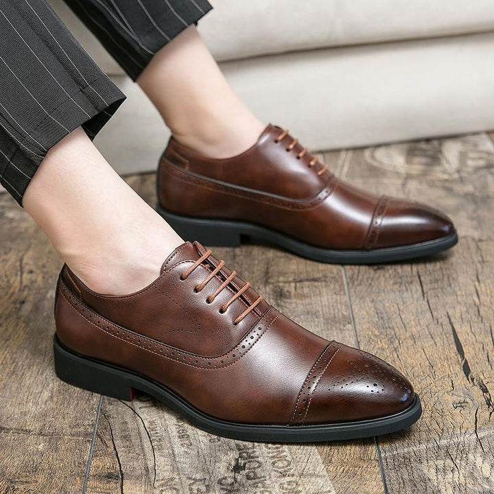 Men's classic black brogue oxford shoes, perfect for elegant formal business wear.