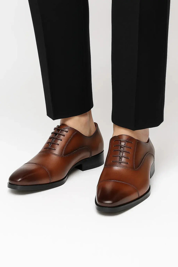 Sleek black Derby dress shoes for men, perfect for elevating formal, business, and sophisticated office styles.