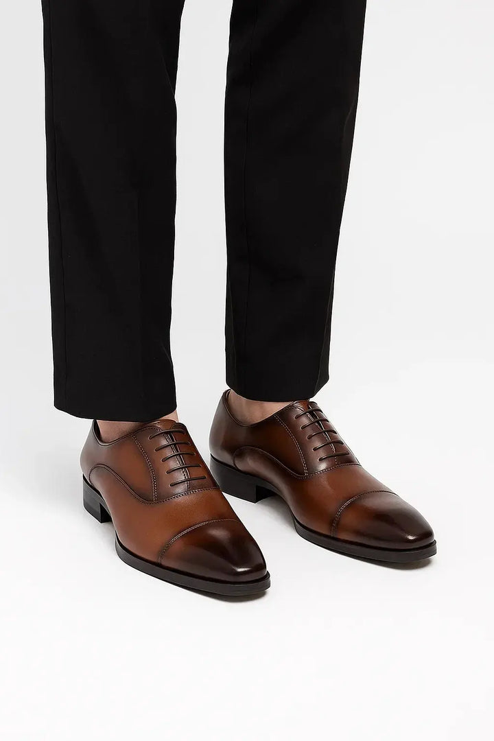 Polished men's black Derby formal shoes, essential elegant footwear for business attire and classic style outfits.