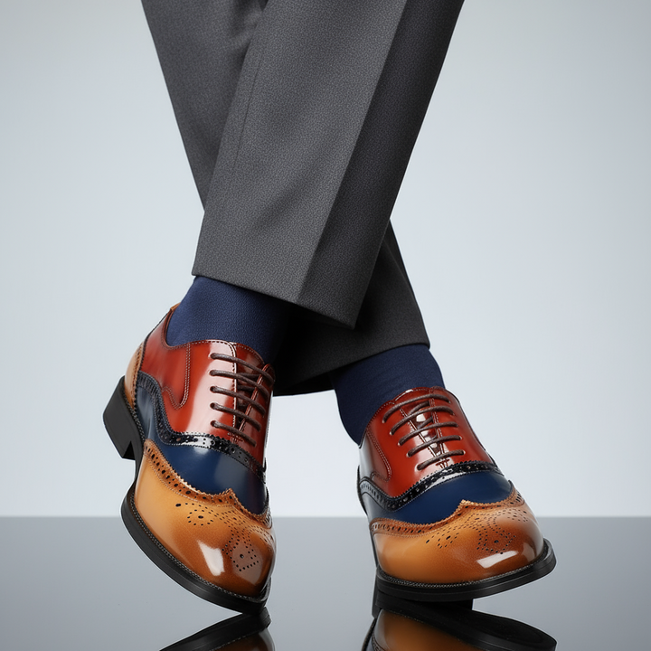 Detailed view of men's elegant wingtip brogue formal shoes, showcasing intricate perforations and classic leather design.