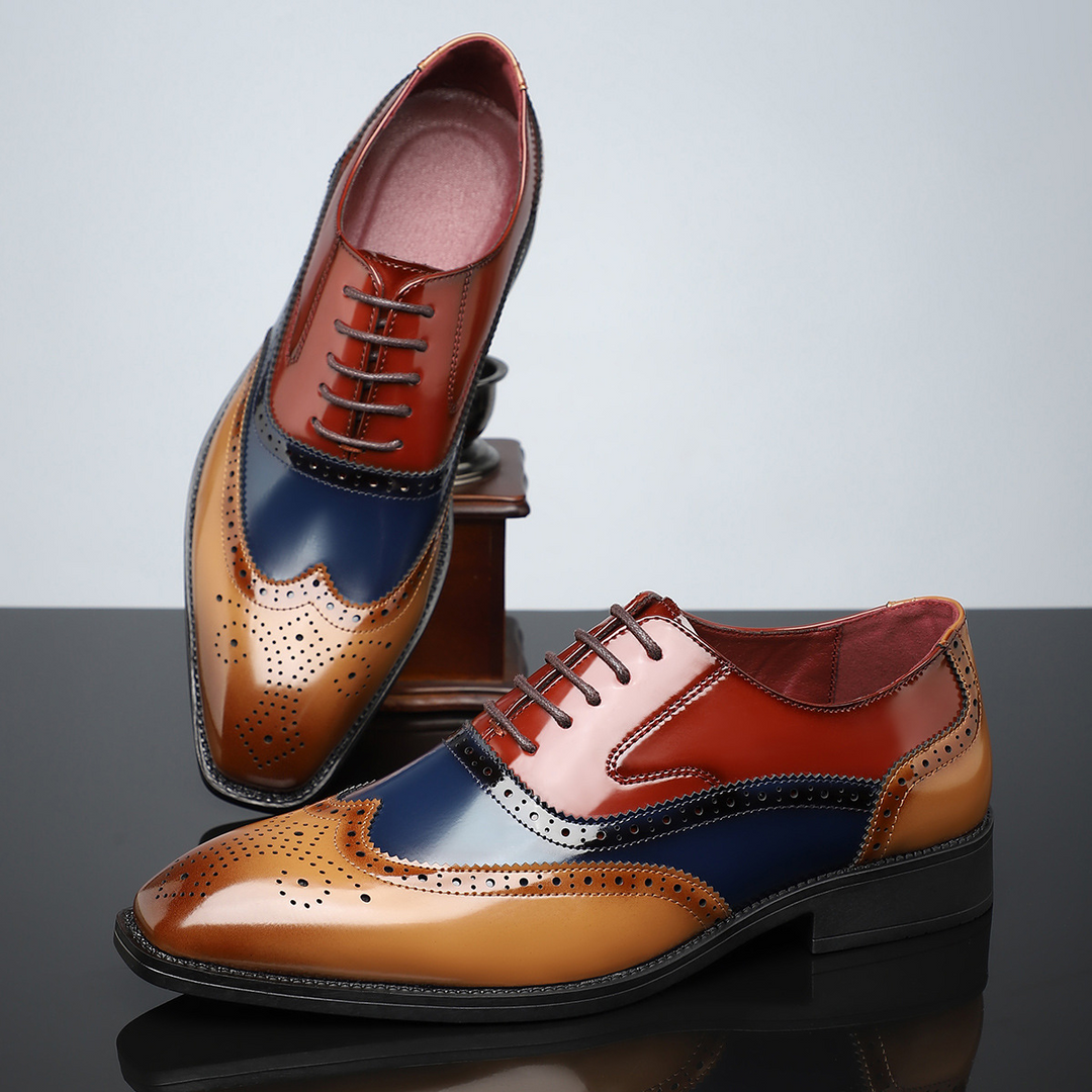 Cognac brown leather men's classic wingtip brogue shoes, offering elegant and sophisticated style for business attire.