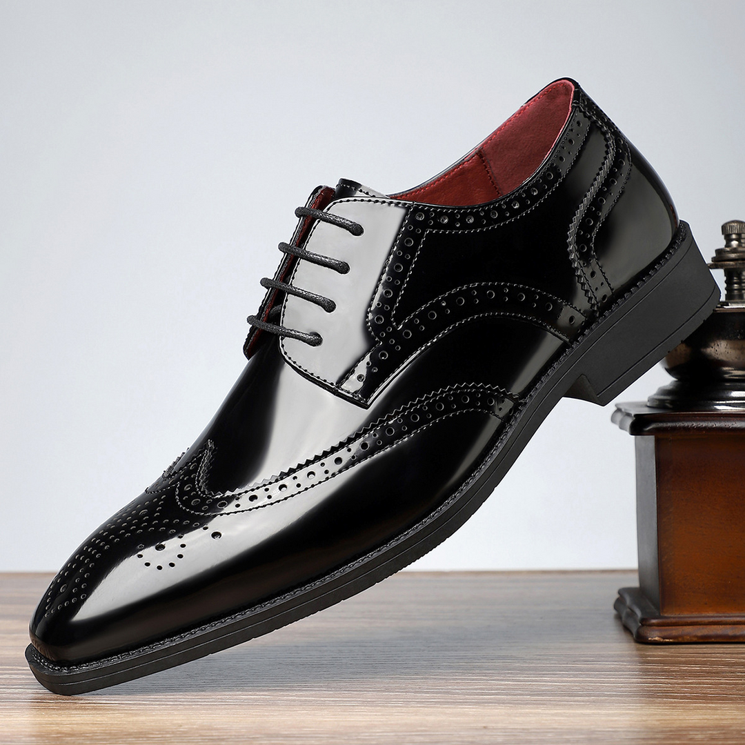 A pair of men's sophisticated leather wingtip brogue dress shoes, perfect for formal events, weddings, and office fashion.