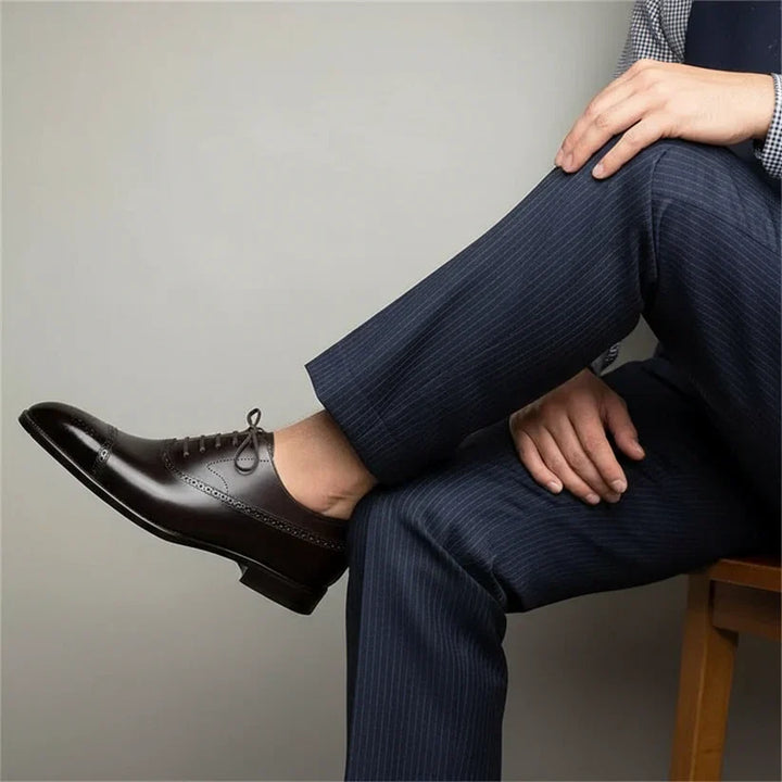 Sophisticated brown Oxford brogue shoes for formal wear, offering a timeless, elegant style for men.