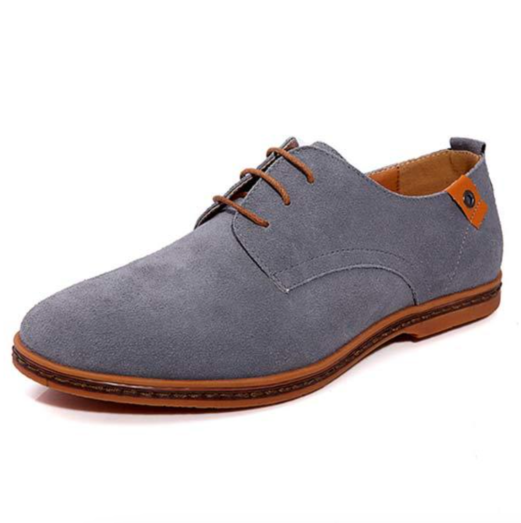 Premium leather men's Oxford dress shoes, highlighting rich texture & fine craftsmanship for a luxurious formal look.