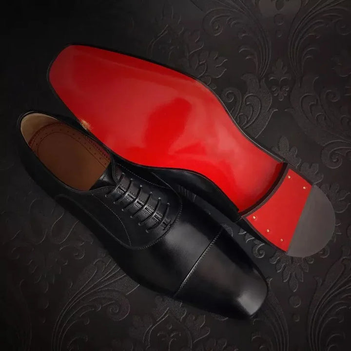 Front view of men's classic lace-up Oxford dress shoes, showcasing the elegant design and iconic red sole.