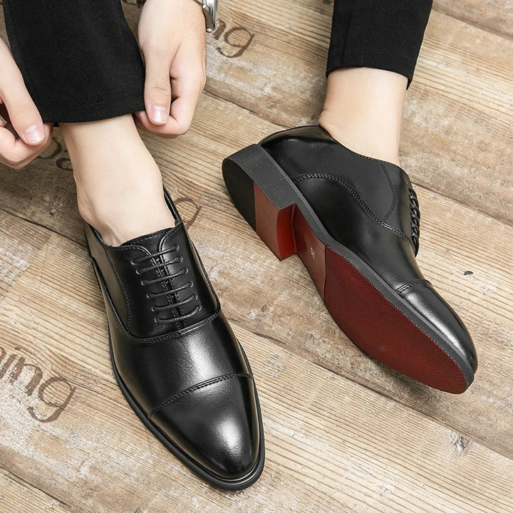 Sophisticated men's fashion Oxford dress shoes with a timeless design and a unique red sole for stylish looks.