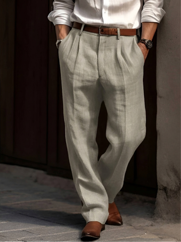 Men's elegant pleated dress pants, straight leg, relaxed fit. Classic style for effortless comfort and versatility.