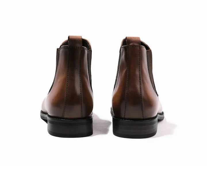 Comfortable men's classic black Chelsea boots. Easy slip-on ankle boots, suitable for modern men's fashion.