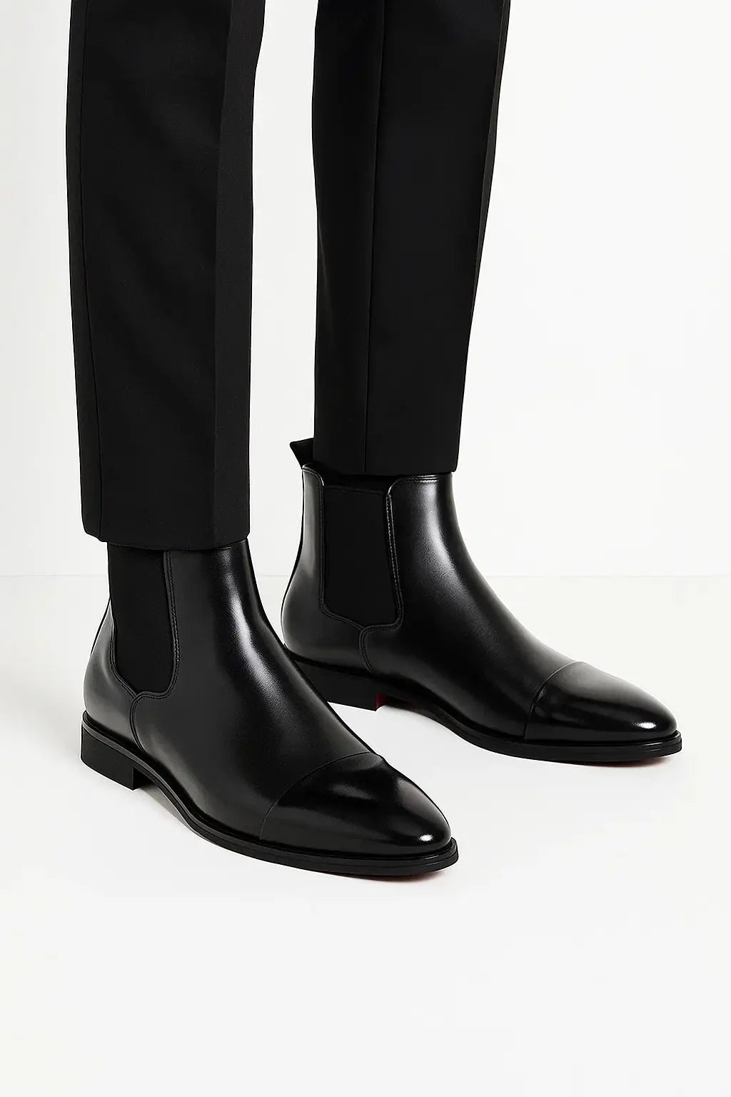 Premium black leather Chelsea boots for men. Versatile formal footwear with comfortable everyday style.