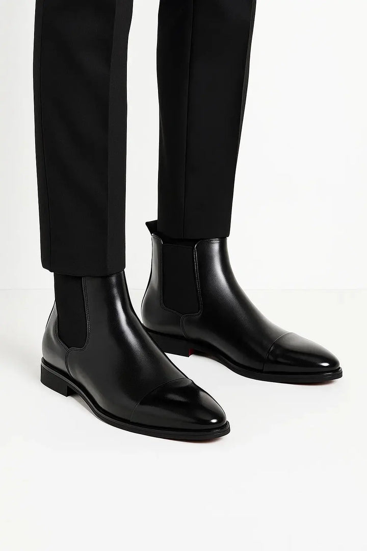 Premium black leather Chelsea boots for men. Versatile formal footwear with comfortable everyday style.