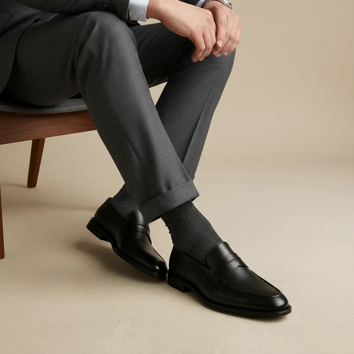 Stylish men's slip-on penny loafers in dark brown. Comfortable and classic casual footwear for modern men's fashion.