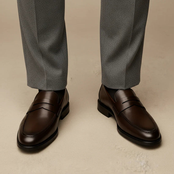 Men's timeless penny loafers in a rich brown hue. Versatile slip-on dress shoes for a refined and relaxed style.
