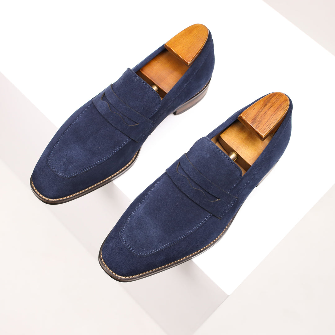 Men's classic brown leather penny loafers, perfect for formal or casual outfits. Comfortable slip-on dress shoes.