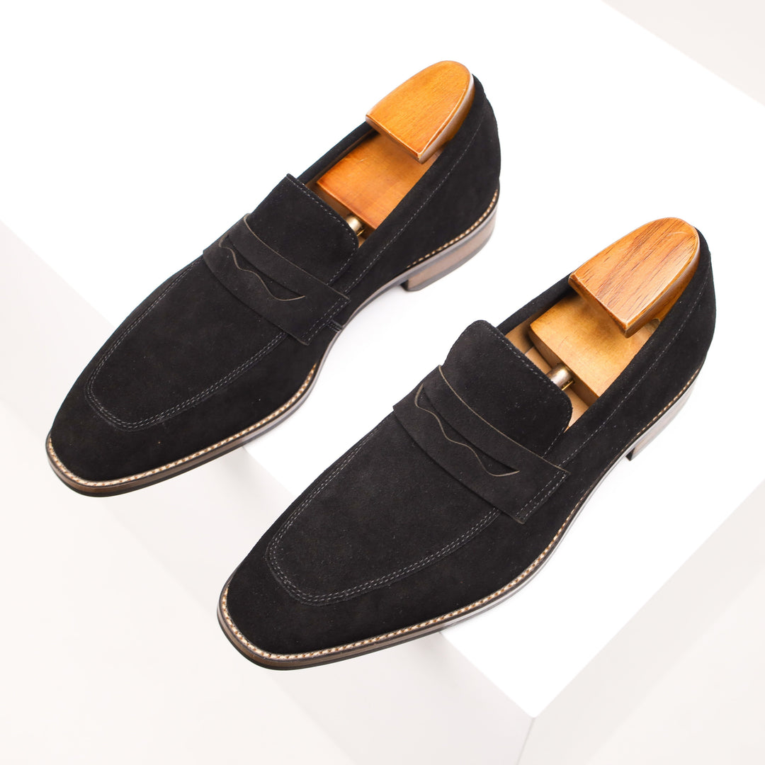 Tan men's classic penny loafers, made from premium leather. Effortless slip-on style, ideal for business or casual wear.