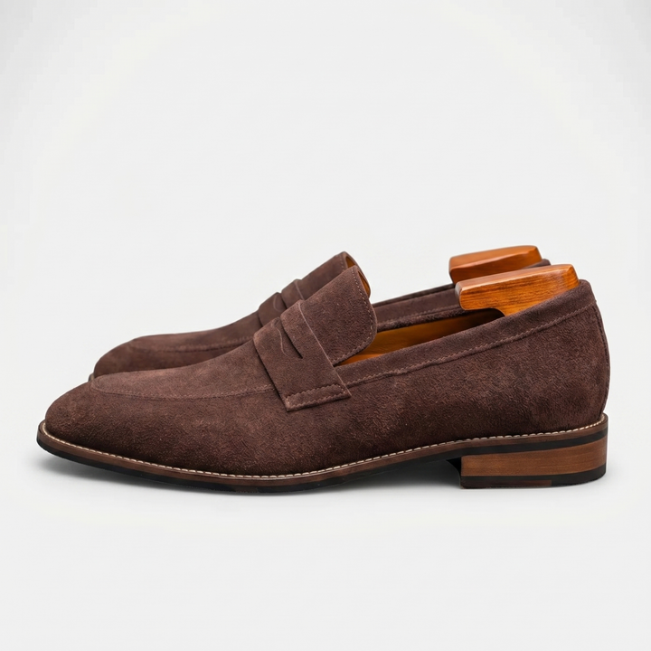 Traditional men's penny loafers with a classic slot design. Comfortable slip-on dress shoes for all-day wear.