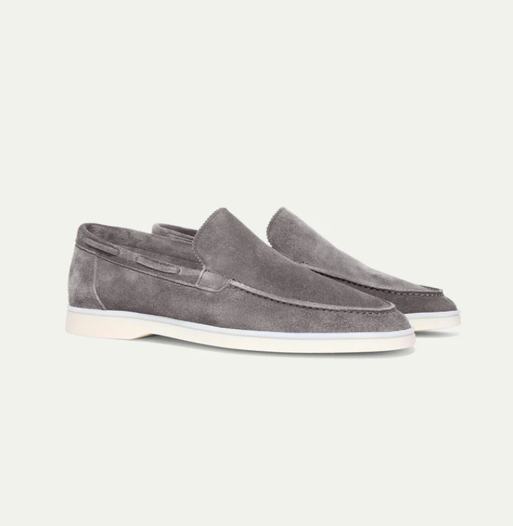 Close-up of men's elegant brown leather slip-on loafers, highlighting comfort and versatile style.