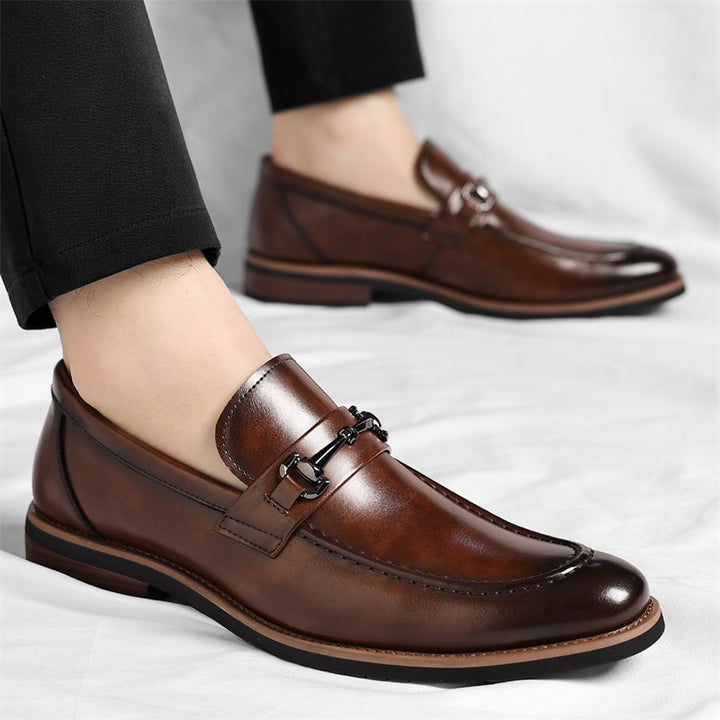 Stylish men's black slip-on loafers, an elegant dress shoe option for modern fashion.