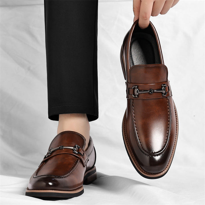 Black slip-on loafers, versatile men's footwear for a classic, sophisticated casual or dress look.