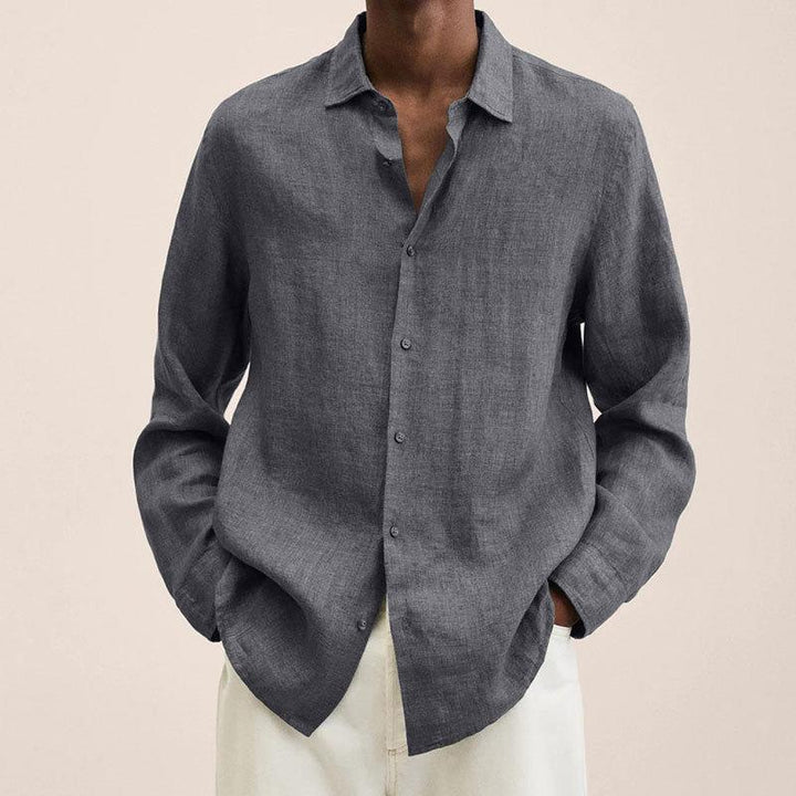 Men's classic button down long sleeve shirt for summer, paired casually for relaxed warm weather fashion.