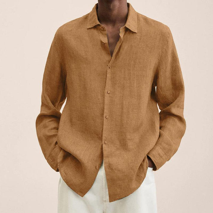Casual men's button down long sleeve shirt styled with rolled sleeves, perfect for everyday summer fashion.