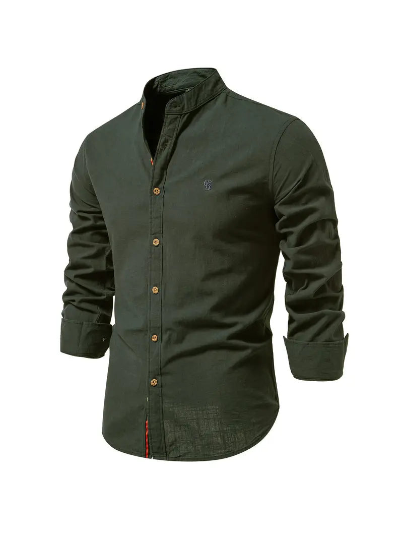 Man confidently walking in a casual long sleeve button-down shirt, a comfortable and stylish menswear option.