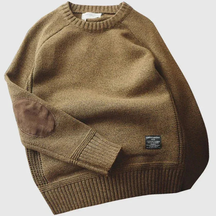 Classic men's crew neck sweater with elegant elbow patches, a versatile long sleeve piece for men's style.